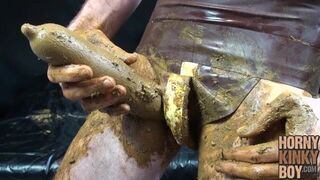 Scat Lover in Brown Rubber Eats and Plays Around
