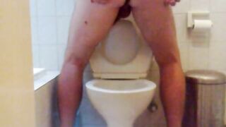 Shitting While Standing Over Toilet